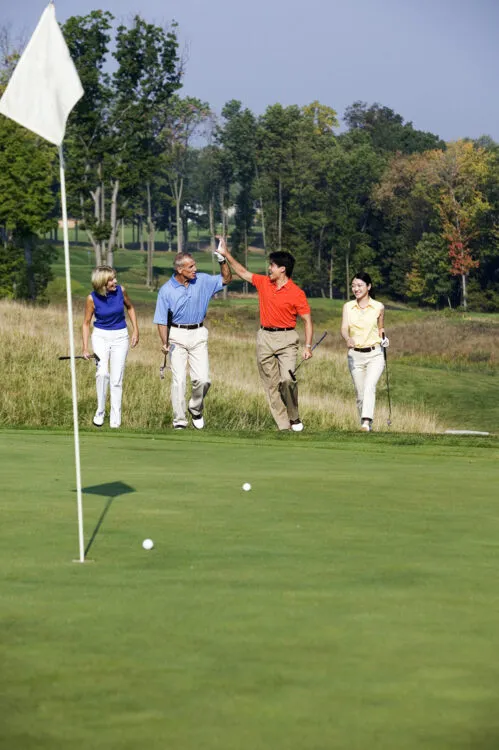 Couples golfing