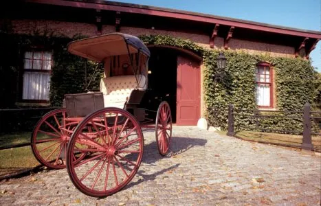 A photograph of The Breakers Stable & Carriage House. This image links to a webpage with information about accessibility at the building.